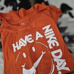 Nike Orange Kids' Graphic Tee with White 'Have A Nike Day' Smile